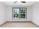 Empty bedroom featuring large windows, neutral walls and light wood floors at 1320 Coral S Way, St Petersburg, FL 33705