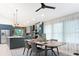 Modern dining area featuring a wood table set with seating for four, complemented by stylish decor and natural light at 1320 Coral S Way, St Petersburg, FL 33705