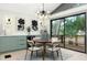 Dining room featuring a modern chandelier, decorative wall sconces and a wine cooler at 1320 Coral S Way, St Petersburg, FL 33705