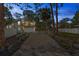 Stunning two-story home with a brick driveway, balcony, and lush landscaping providing curb appeal at 1320 Coral S Way, St Petersburg, FL 33705