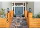 Inviting entrance features stone steps, craftsman lights, and modern wood planters at 1320 Coral S Way, St Petersburg, FL 33705