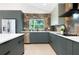 Well-appointed kitchen featuring stainless steel appliances, stylish backsplash, and a functional layout for cooking at 1320 Coral S Way, St Petersburg, FL 33705