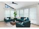 Bright living room filled with sunlight features plush seating and light wood floors at 1320 Coral S Way, St Petersburg, FL 33705