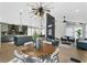 Open-concept living area with modern lighting, comfortable seating, and a view of the kitchen at 1320 Coral S Way, St Petersburg, FL 33705