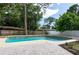 Private backyard features a sparkling swimming pool and a brick paver patio at 1320 Coral S Way, St Petersburg, FL 33705