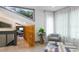 Cozy sitting area with comfortable chair and ottoman, bathed in natural light from large windows at 1320 Coral S Way, St Petersburg, FL 33705