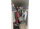 Walk-in closet with rack and shelves for clothes and other personal belongings at 14305 Tennyson Dr, Hudson, FL 34667