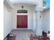 Inviting entryway featuring a stylish double door and decorative accents at 14305 Tennyson Dr, Hudson, FL 34667