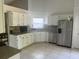 Bright kitchen with stainless steel appliances, granite countertops, and ample storage space at 14305 Tennyson Dr, Hudson, FL 34667