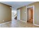 Bright living room with tile flooring, entry closet, and staircase at 15203 W Pond Woods Dr, Tampa, FL 33618