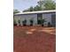 Metal clad structure with green door and decorative plants at 16251 Us Highway 301, Dade City, FL 33523