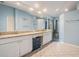 Bright bathroom with double sinks, granite countertops, and tile flooring at 16808 Woburn Ln, Lutz, FL 33549