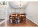Elegant dining area featuring hardwood floors, chandelier lighting, and a welcoming ambiance at 16808 Woburn Ln, Lutz, FL 33549
