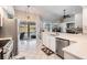 Open kitchen with view of the pool, stainless steel appliances, and tile floors at 16808 Woburn Ln, Lutz, FL 33549