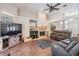 Living room with fireplace, hardwood floors, and comfortable seating at 16808 Woburn Ln, Lutz, FL 33549