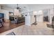 Open living space connects kitchen, living room with fireplace, and tile/wood floors at 16808 Woburn Ln, Lutz, FL 33549