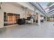 Spacious patio area with a grill and access to the home's interior at 16808 Woburn Ln, Lutz, FL 33549