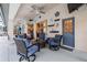 Outdoor patio with wicker seating, ceiling fans, and nautical decorations at 16808 Woburn Ln, Lutz, FL 33549