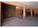 Parking garage with shower and stacked stone accent wall at 17035 Gulf Blvd # 205, North Redington Beach, FL 33708