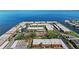 Expansive aerial view featuring a waterfront community, complemented by scenic bridge and lush palm trees at 19029 Us Highway 19 N # 27E, Clearwater, FL 33764