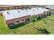 Community aerial showing roof tops and landscaping, complemented by well-manicured lawns at 19029 Us Highway 19 N # 27E, Clearwater, FL 33764