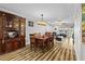 Spacious dining room features wood floors, ample seating, and flows seamlessly into the inviting living area at 19029 Us Highway 19 N # 27E, Clearwater, FL 33764