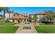Stunning exterior view of the community center, showcasing beautiful landscaping and welcoming entrance at 19029 Us Highway 19 N # 27E, Clearwater, FL 33764