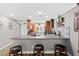 Modern kitchen with island seating, stainless steel appliances, and stylish wooden cabinetry at 19029 Us Highway 19 N # 27E, Clearwater, FL 33764