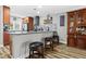 Spacious kitchen with island seating, modern lighting, and stylish wooden cabinetry at 19029 Us Highway 19 N # 27E, Clearwater, FL 33764