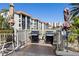 Outdoor patio area featuring grills, tables, and chairs, perfect for entertaining with a view of the surrounding buildings at 19029 Us Highway 19 N # 27E, Clearwater, FL 33764