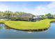 Stunning backyard with a large pond, lush landscaping and screened in lanai at 19230 Wind Dancer St, Lutz, FL 33558