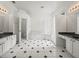 Large primary bathroom with double sinks, soaking tub and decorative glass block shower at 19230 Wind Dancer St, Lutz, FL 33558