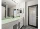 This bathroom features an opaque glass-door to the outside and a modern sink and countertop at 19230 Wind Dancer St, Lutz, FL 33558