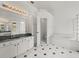 Spacious bathroom with separate vanities, walk-in shower, soaking tub, and private toilet room at 19230 Wind Dancer St, Lutz, FL 33558