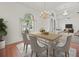Airy dining room featuring natural light, elegant chandelier, and an open floor plan at 19230 Wind Dancer St, Lutz, FL 33558