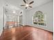 Spacious living room with lots of natural light, chandeliers and tile and wood floors at 19230 Wind Dancer St, Lutz, FL 33558