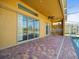 Outdoor patio featuring brick flooring and access to swimming pool area at 19230 Wind Dancer St, Lutz, FL 33558