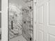 Modern bathroom featuring marble tiled shower stall with glass door at 19230 Wind Dancer St, Lutz, FL 33558