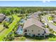 Aerial view of the property with a screened pool, mature trees, and well-maintained lawn at 19412 Lonesome Pine Dr, Land O Lakes, FL 34638