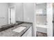 Bathroom featuring a granite countertop sink and a separate tiled shower and tub at 19412 Lonesome Pine Dr, Land O Lakes, FL 34638