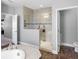 Bathroom featuring a glass-enclosed shower, tile and luxury vinyl plank flooring at 19412 Lonesome Pine Dr, Land O Lakes, FL 34638