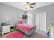 Adorable princess themed bedroom with a carriage bed and dual closets at 19412 Lonesome Pine Dr, Land O Lakes, FL 34638