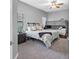 Neutral bedroom features plush carpet, a ceiling fan, natural light, and a bed with bunk bed, optimizing space at 19412 Lonesome Pine Dr, Land O Lakes, FL 34638