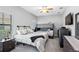 Well-lit bedroom featuring a bunk bed setup, dresser, TV, ceiling fan, and soft carpeting, ideal for flexible living at 19412 Lonesome Pine Dr, Land O Lakes, FL 34638