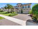 Stunning home showcasing lush landscaping, a circular driveway, and a grand facade at 19412 Lonesome Pine Dr, Land O Lakes, FL 34638