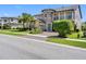 Charming two-story home with stone tower, well-kept lawn, and manicured landscaping at 19412 Lonesome Pine Dr, Land O Lakes, FL 34638