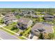 Beautiful two-story home with lush landscaping, elegant architectural details and well-manicured lawn at 19412 Lonesome Pine Dr, Land O Lakes, FL 34638