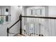 Bright foyer showcasing a soaring ceiling, elegant chandelier, and staircase at 19412 Lonesome Pine Dr, Land O Lakes, FL 34638