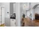 Inviting hallway with hardwood floors and a convenient coffee bar area at 19412 Lonesome Pine Dr, Land O Lakes, FL 34638