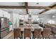 Gourmet kitchen with granite counters, stainless appliances, seating, and open to the living area at 19412 Lonesome Pine Dr, Land O Lakes, FL 34638